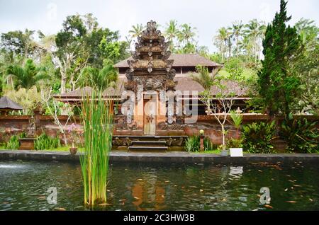 Bali temple gate - Pura Tirta Empul. Holy spring water in temple pura Tirtha Empul in Tampak, one of Bali`s most important temples, Indonesia Stock Photo